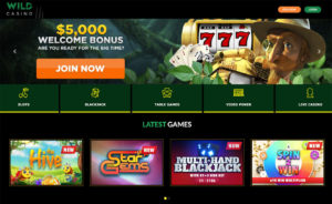 Zrzut ekranu strony głównej Wild Casino z banerem bonusu powitalnego