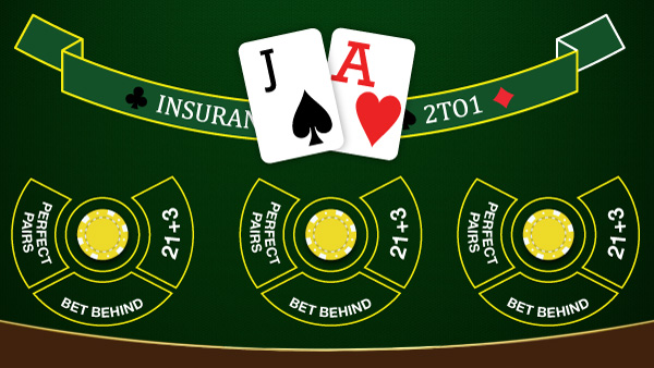 Top view of a blackjack casino table with two dealt cards and the options to place side bets.